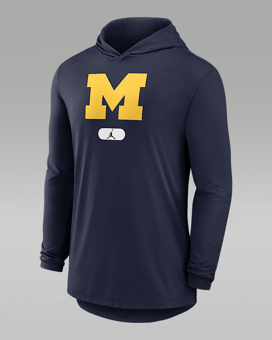 Michigan Wolverines Men s Jordan Brand Dri FIT College Long Sleeve Hooded T Shirt. Nike